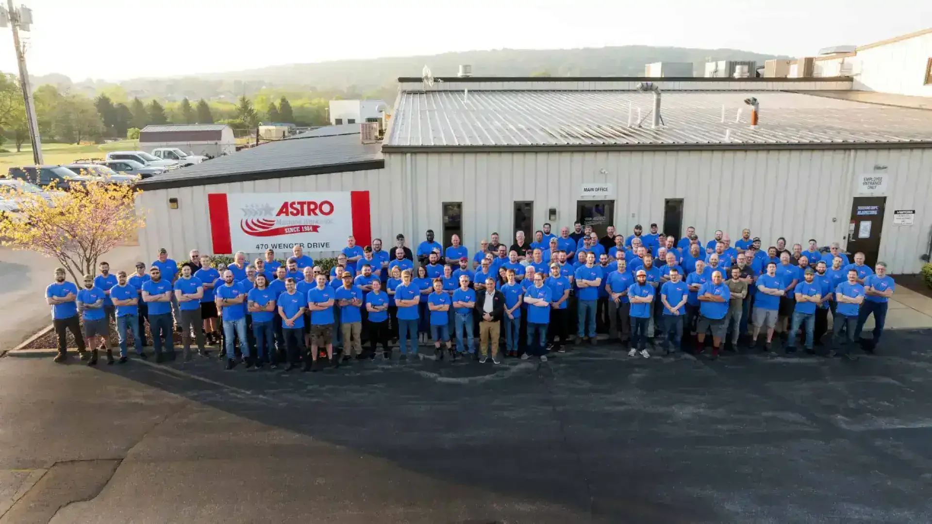 The whole Astro Machine Works team in front of the plant at 470 Wenger Drive, Ephrata
