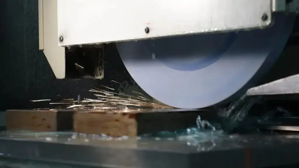 Sparks from a grinding wheel on a steel part