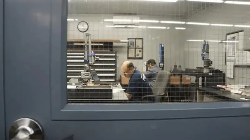 Astro inspectors at work in the climate-controlled inspection room