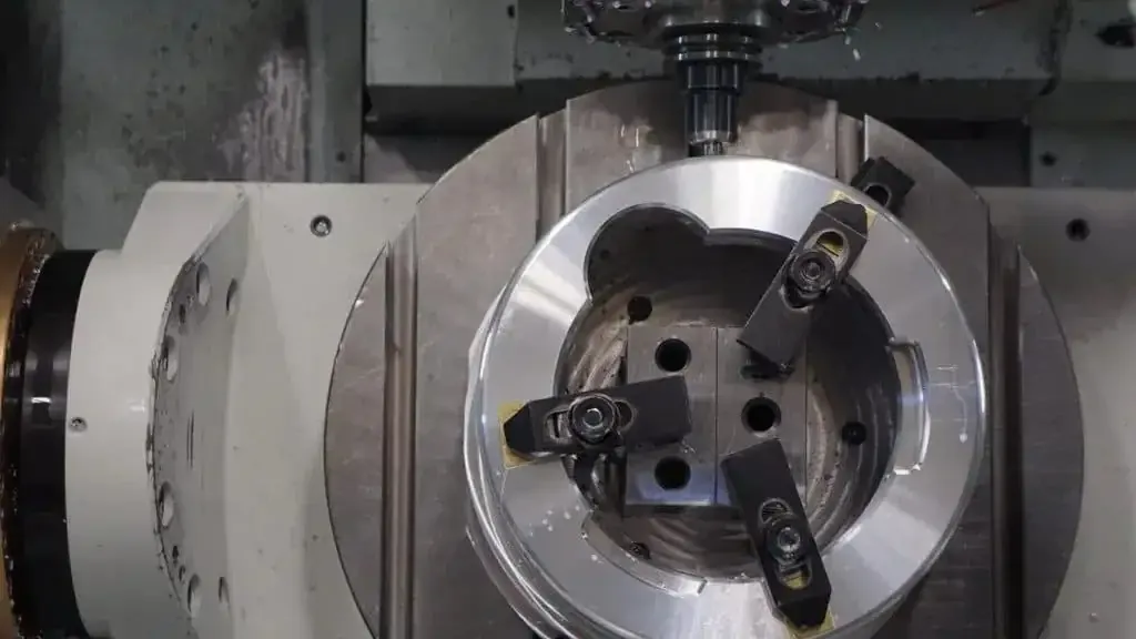 Part fixtured on the trunnion of a 5-axis machining center